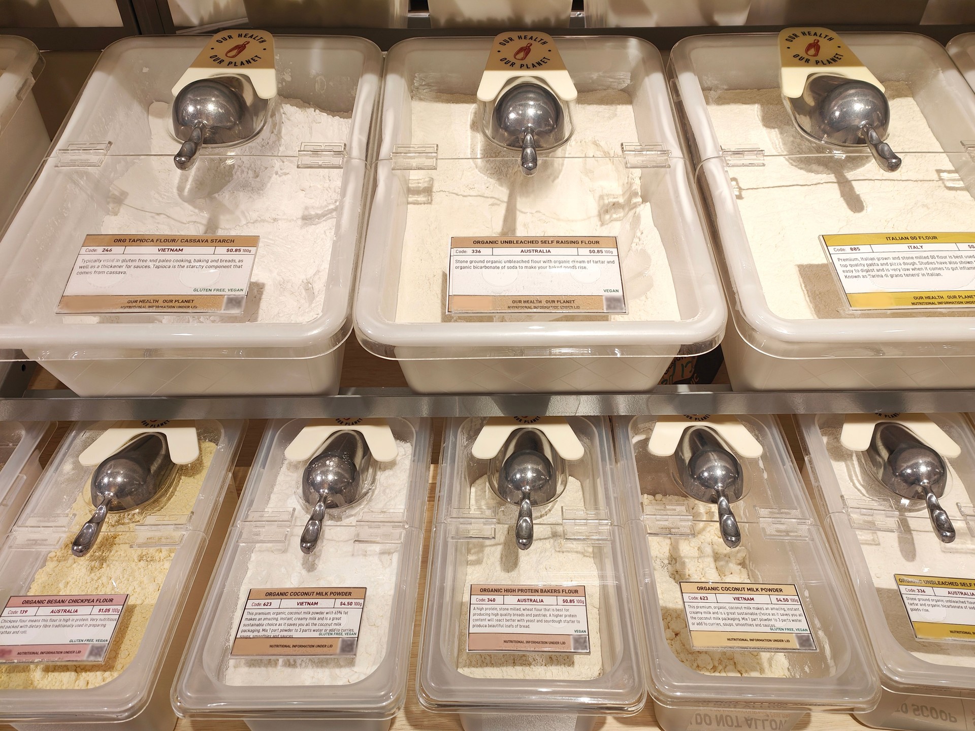 Bulk Bins Filled with Various Dried Flours in Sustainable Store